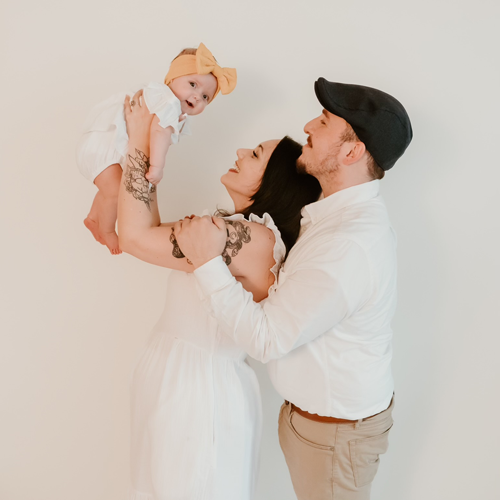 Ezzi and his wife with their daughter.